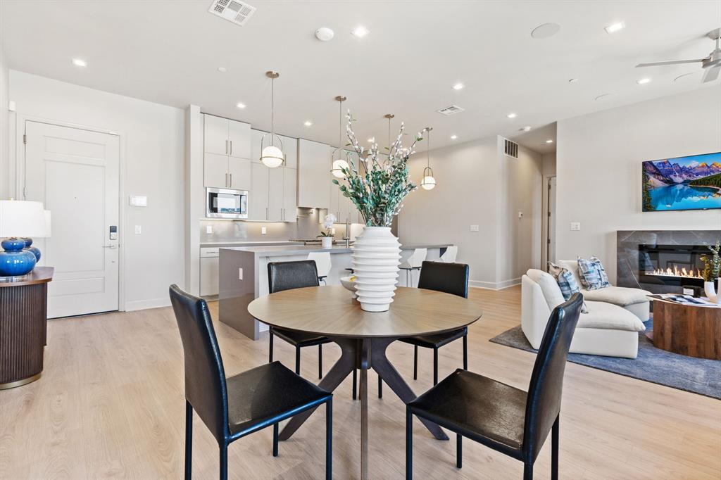 1900 South Ervay Street, Unit 508 Dallas, TX 75215 - Photo 12 of 39 a view of a dining room with furniture and wooden floor