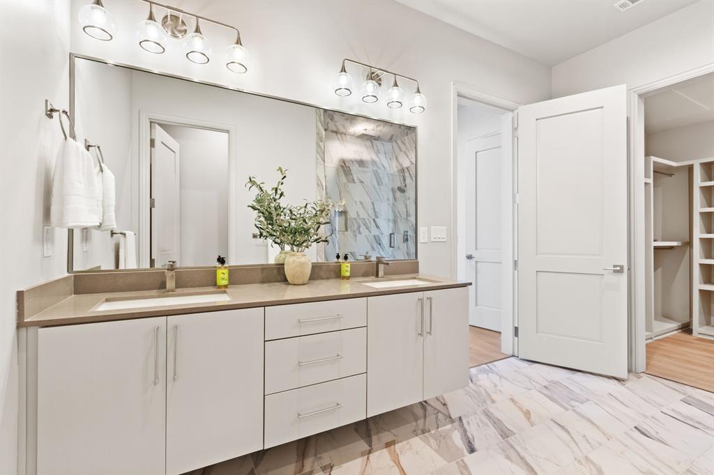 1900 South Ervay Street, Unit 508 Dallas, TX 75215 - Photo 16 of 39 a bathroom with a sink and a mirror