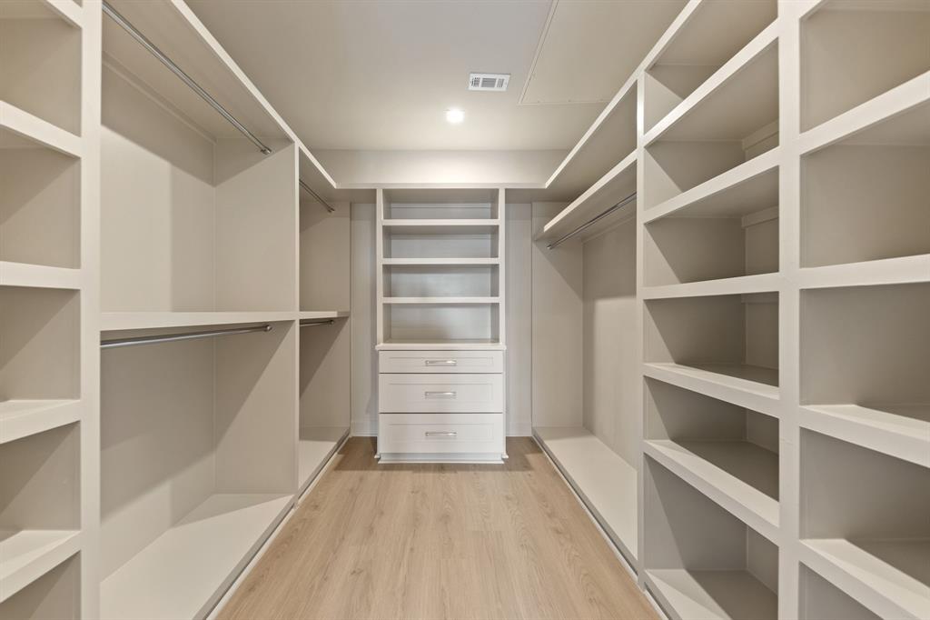 1900 South Ervay Street, Unit 508 Dallas, TX 75215 - Photo 19 of 36 a view of walk in closet with empty racks