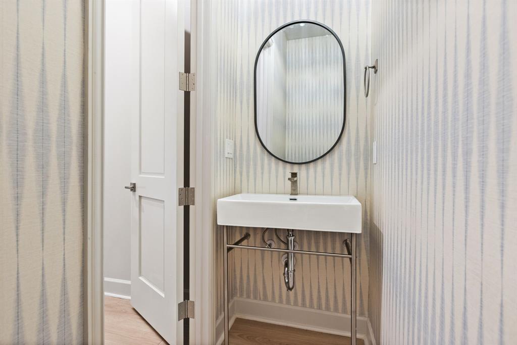 1900 South Ervay Street, Unit 508 Dallas, TX 75215 - Photo 20 of 39 a bathroom with a sink and a mirror