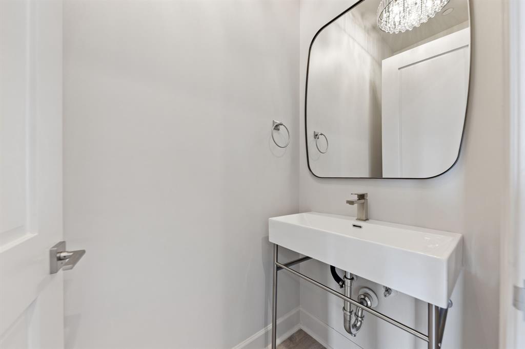 1900 South Ervay Street, Unit 508 Dallas, TX 75215 - Photo 5 of 36 a bathroom with a sink and a mirror