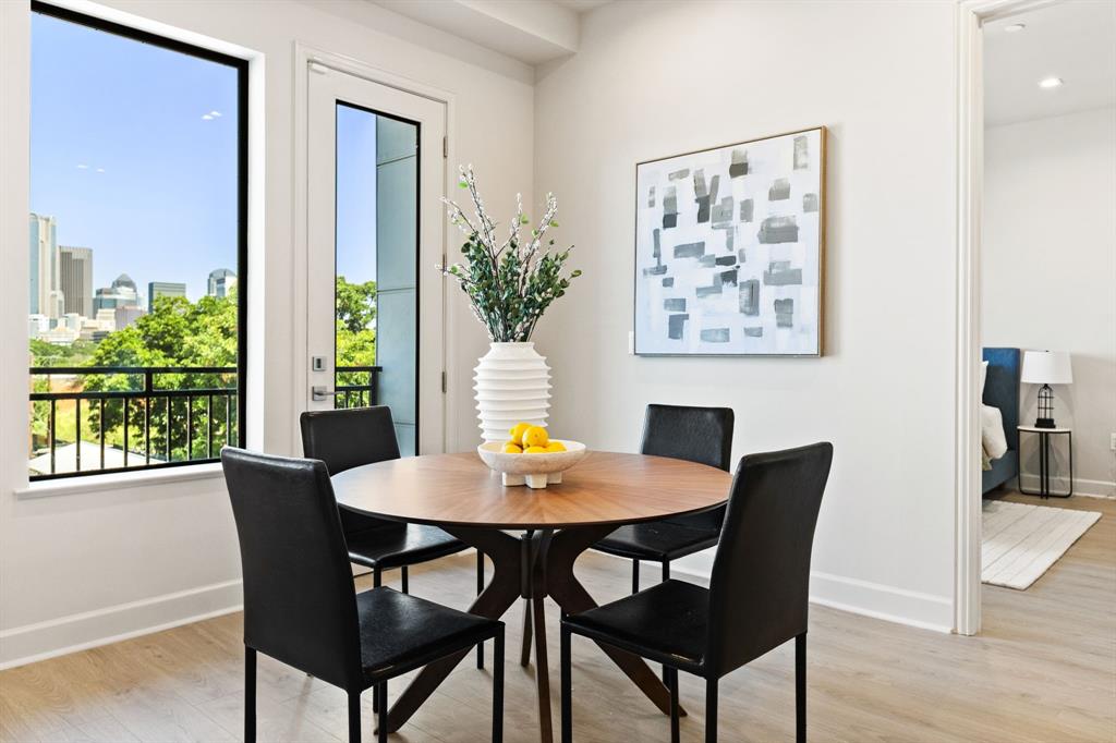 1900 South Ervay Street, Unit 508 Dallas, TX 75215 - Photo 10 of 39 a view of a dining room with furniture window and wooden floor