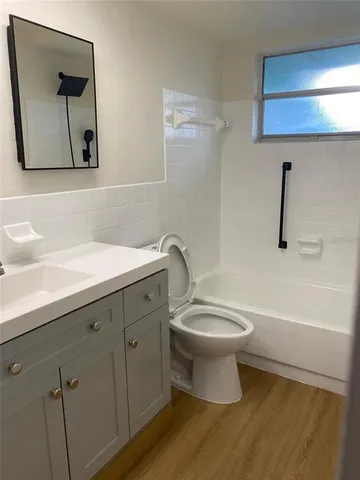 a bathroom with a sink a toilet and a bathtub