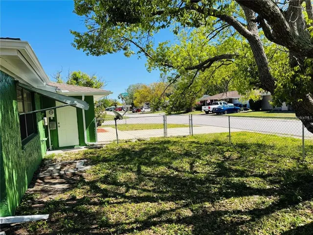 a view of a garden with an outdoor space