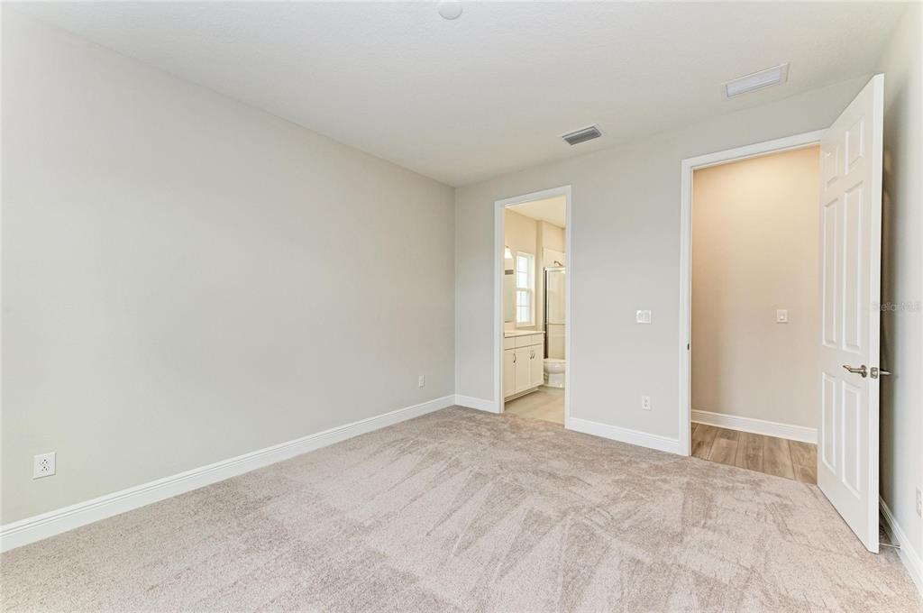 17915 Cropside Trail Lakewood Ranch, FL 34211 - Photo 23 of 33 a view of an empty room and closet area