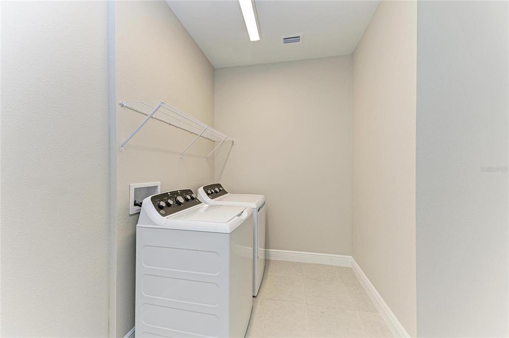 17915 Cropside Trail Lakewood Ranch, FL 34211 - Photo 30 of 33 a utility room with dryer and washer