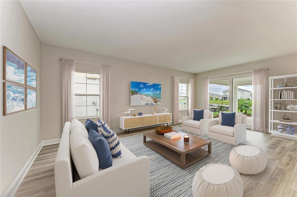 17915 Cropside Trail Lakewood Ranch, FL 34211 - Photo 3 of 33 a living room with furniture and a large window