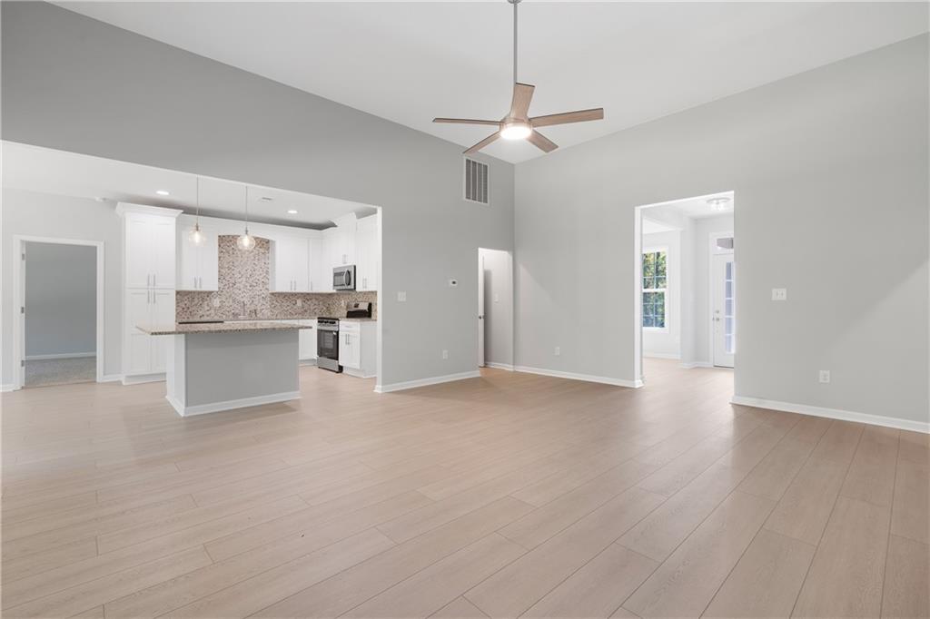 4477 Rivercliff Way Gray, GA 31032 - Photo 13 of 62 a view of a kitchen with wooden floor and a kitchen