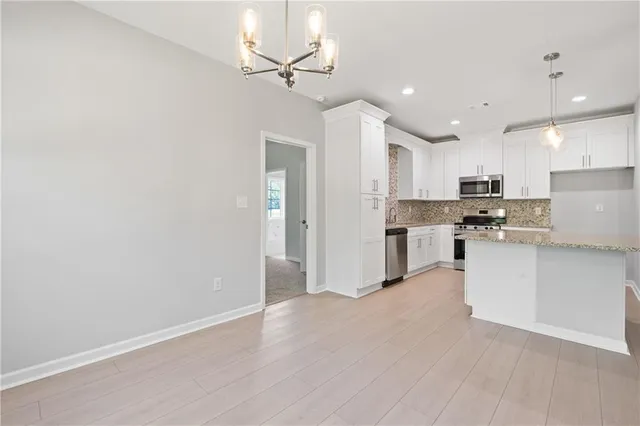 a bathroom with a bathtub and a window