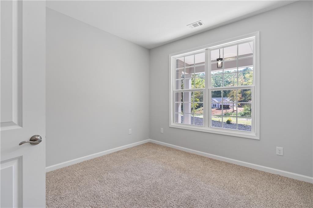 4477 Rivercliff Way Gray, GA 31032 - Photo 43 of 62 a view of an empty room with a window