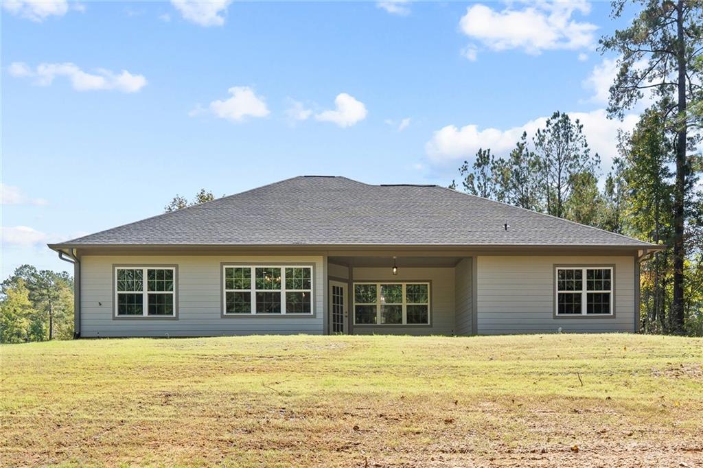 4477 Rivercliff Way Gray, GA 31032 - Photo 59 of 62 a view of a house with a yard and a large tree
