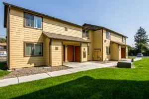 a view of a house with a yard and sitting area