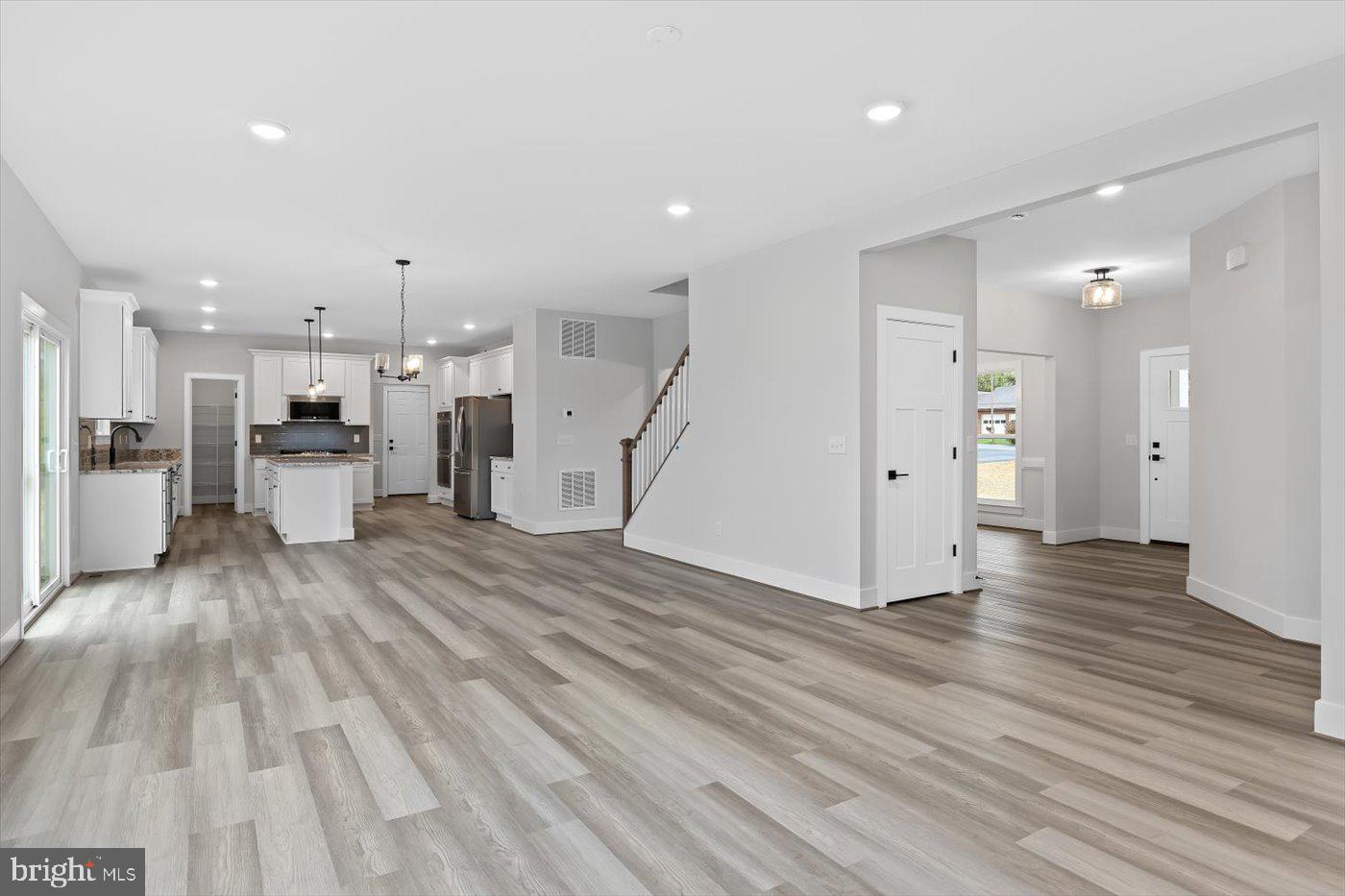 575 Solgrove Road Warrenton, VA 20186 - Photo 14 of 40 a view of a living room with a wooden floor