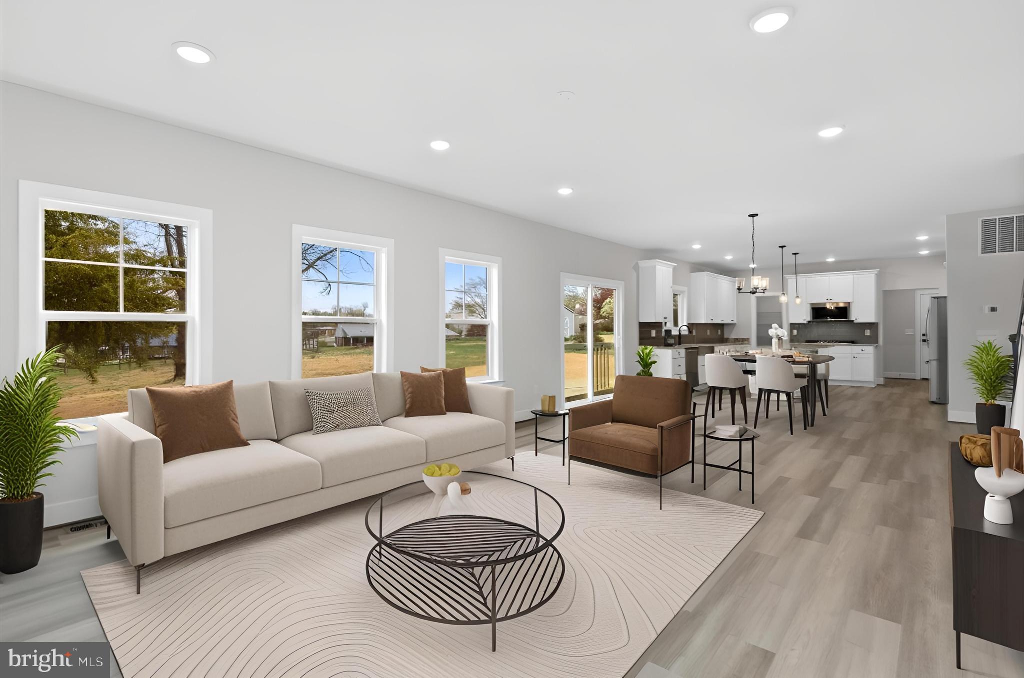 575 Solgrove Road Warrenton, VA 20186 - Photo 4 of 40 a living room with furniture and a table