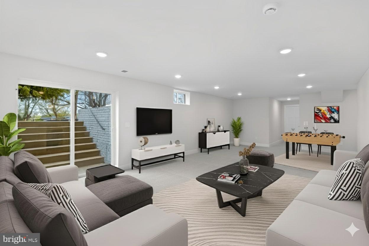 575 Solgrove Road Warrenton, VA 20186 - Photo 8 of 40 a living room with furniture and a flat screen tv