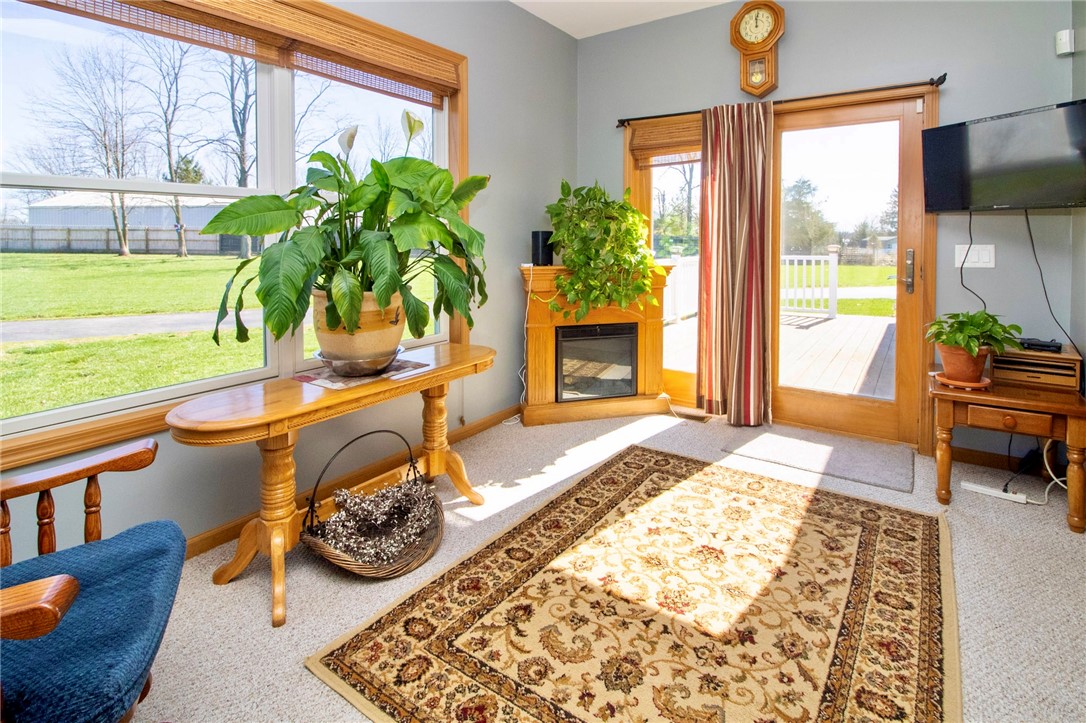 1000 Stone Road Xenia, OH 45385 - Photo 13 of 39 This bright sunroom offers a cozy retreat with abundant natural light.