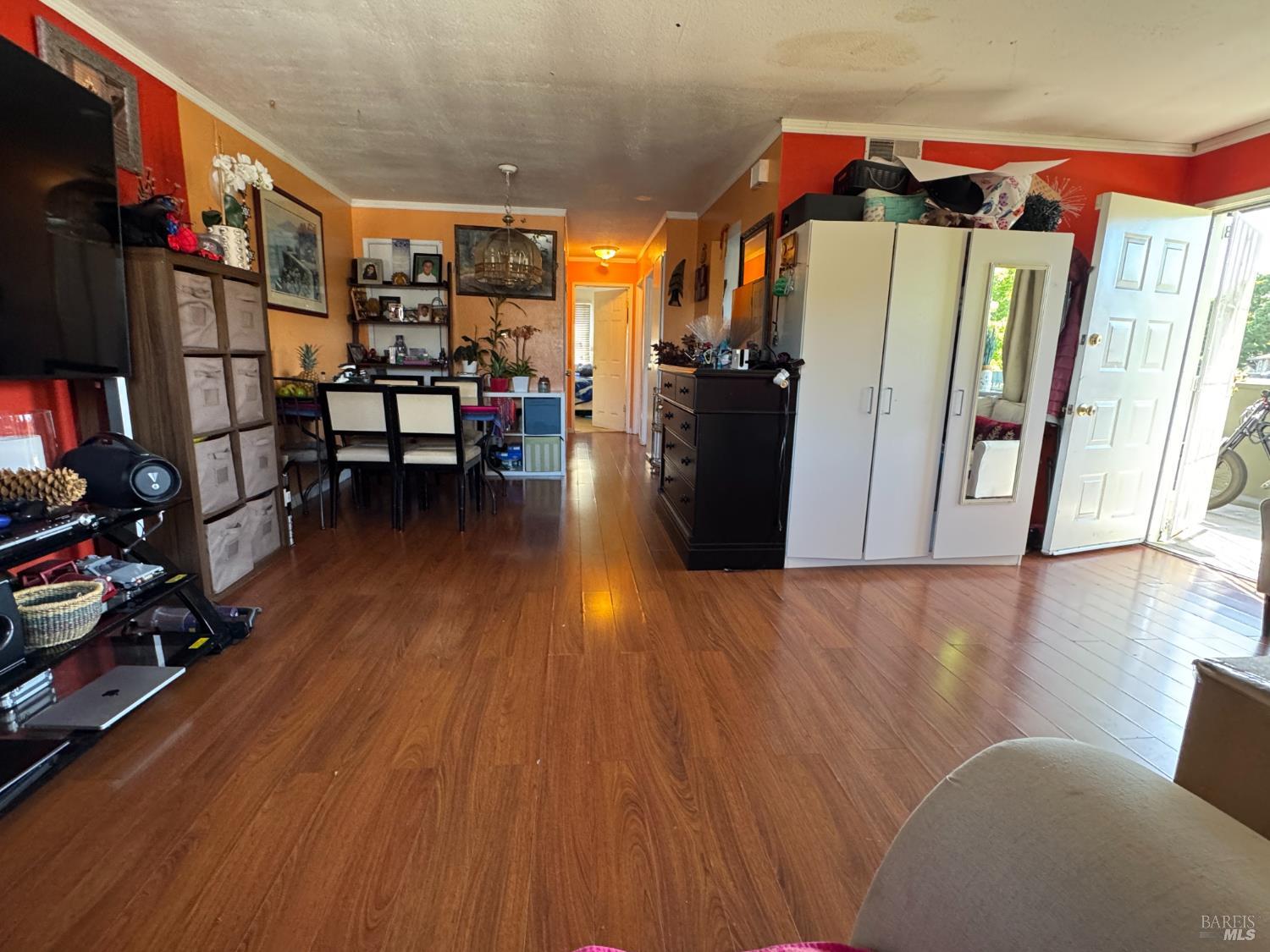 431 Bahia Way San Rafael, CA 94901 - Photo 20 of 46 a view of a hallway with wooden floor and furniture