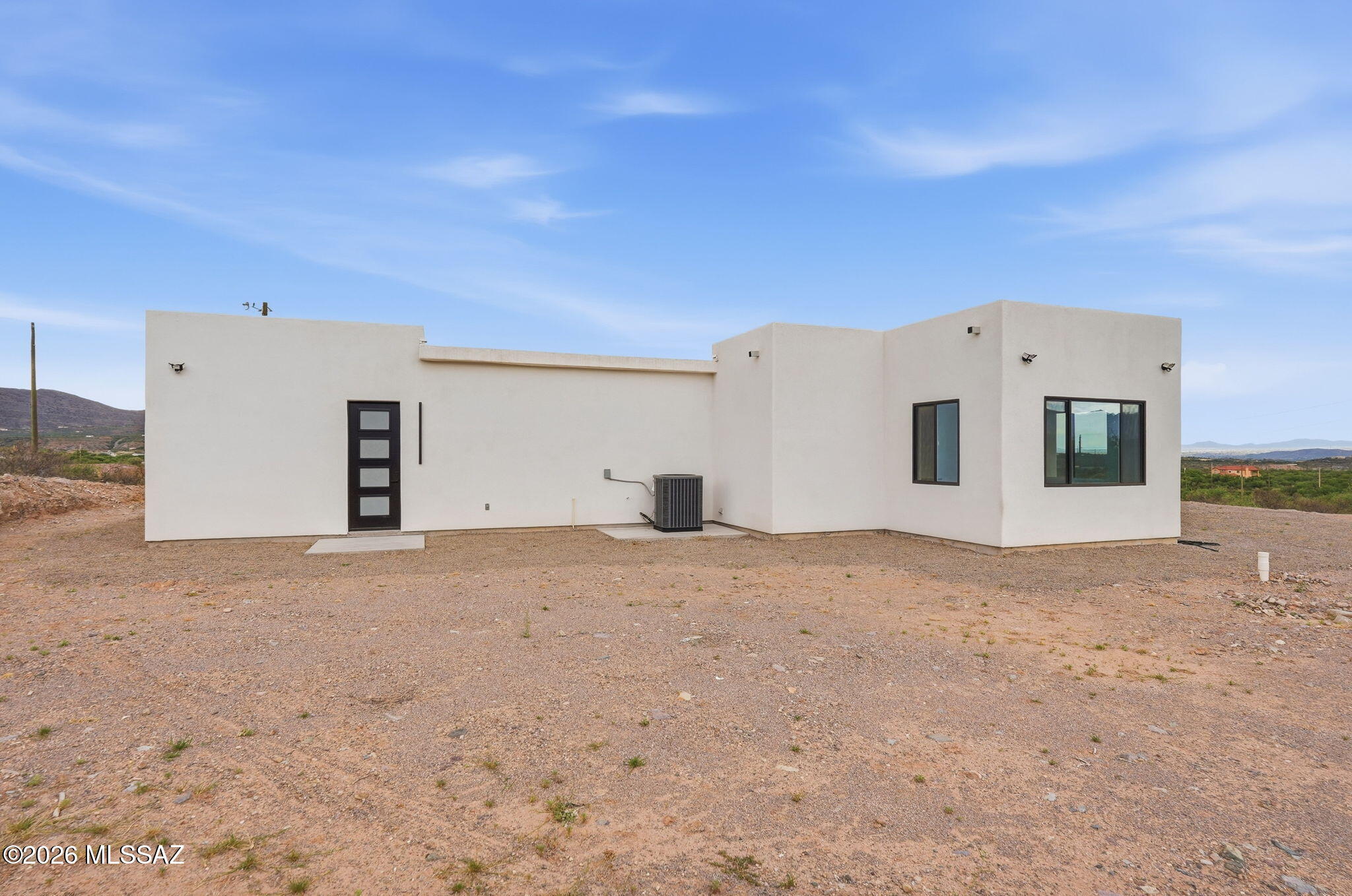 1786 Peralta Court Rio Rico, AZ 85648 - Photo 47 of 50 a view of a white house with a yard
