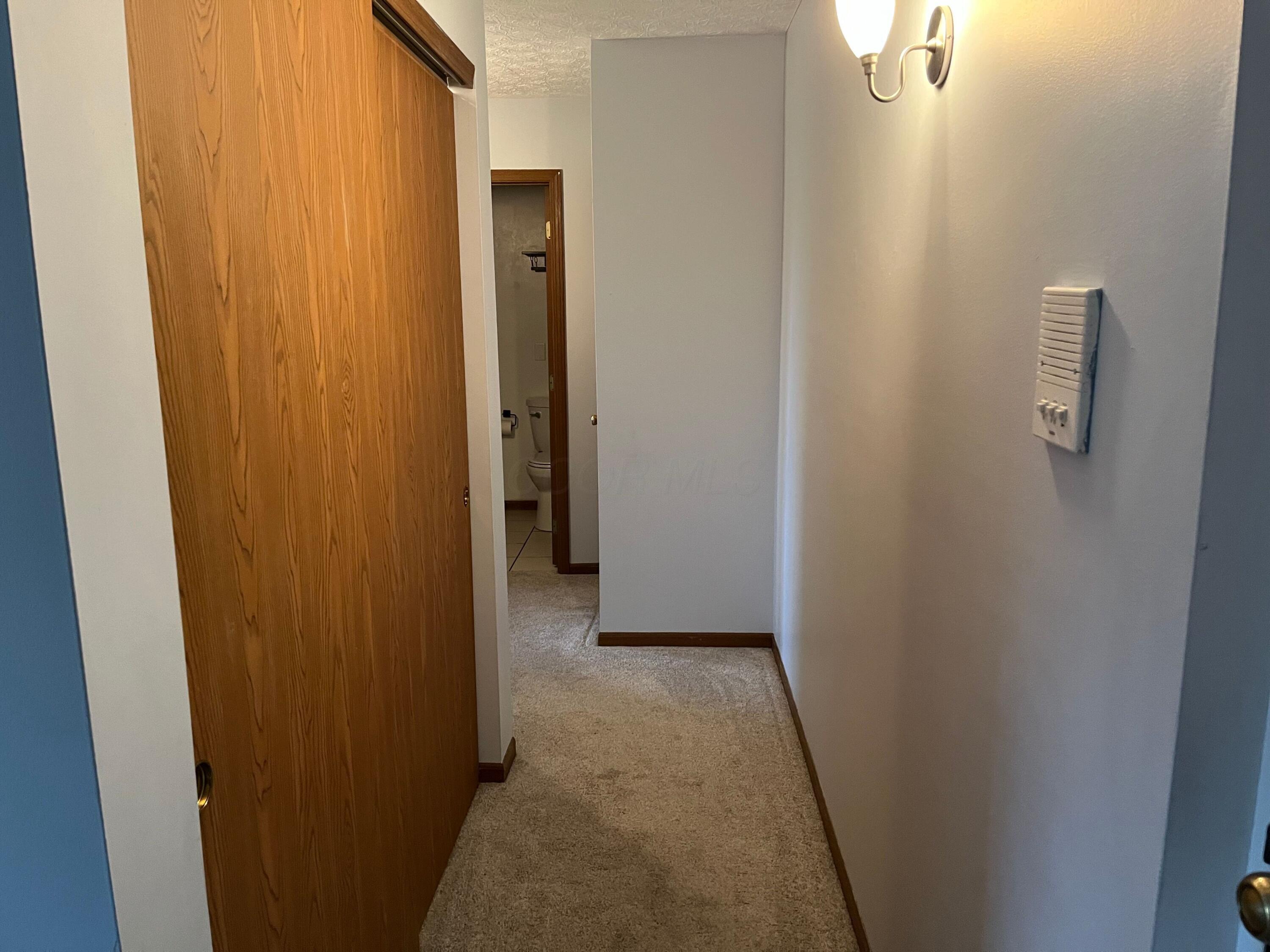 4115 Karl Road, Unit 309 Columbus, OH 43224 - Photo 16 of 45 Hallway to bedrooms and utility closet is on the left.