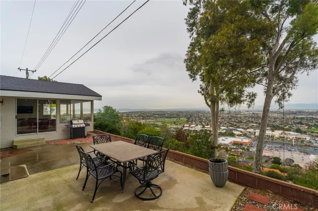 a view of a patio with a table chairs and a patio