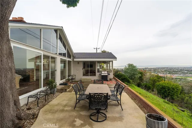 a view of a city and mountain from a balcony