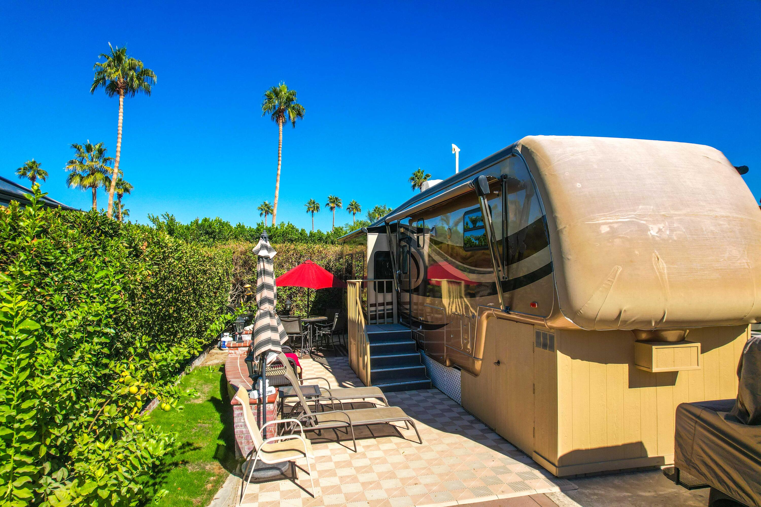 69411 Ramon Road, Unit 360 Cathedral City, CA 92234 - Photo 15 of 66 a front view of a house with a backyard