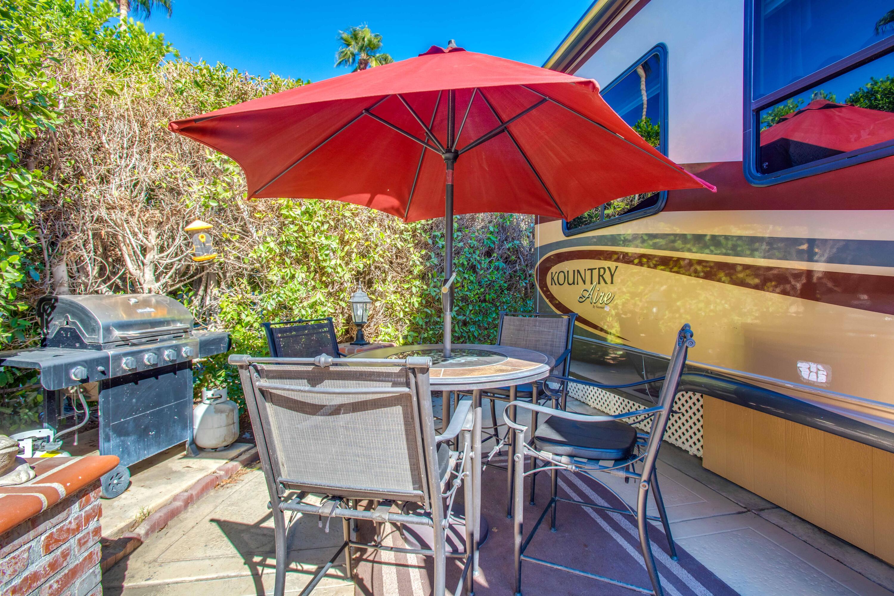 69411 Ramon Road, Unit 360 Cathedral City, CA 92234 - Photo 18 of 66 a view of an outdoor sitting area with furniture and umbrella