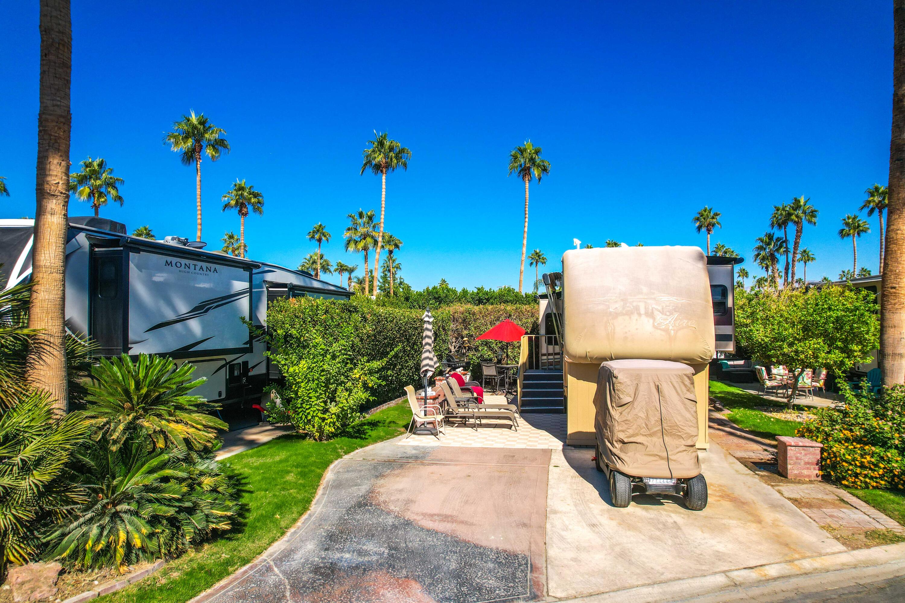 69411 Ramon Road, Unit 360 Cathedral City, CA 92234 - Photo 2 of 66 a front view of a house with a yard