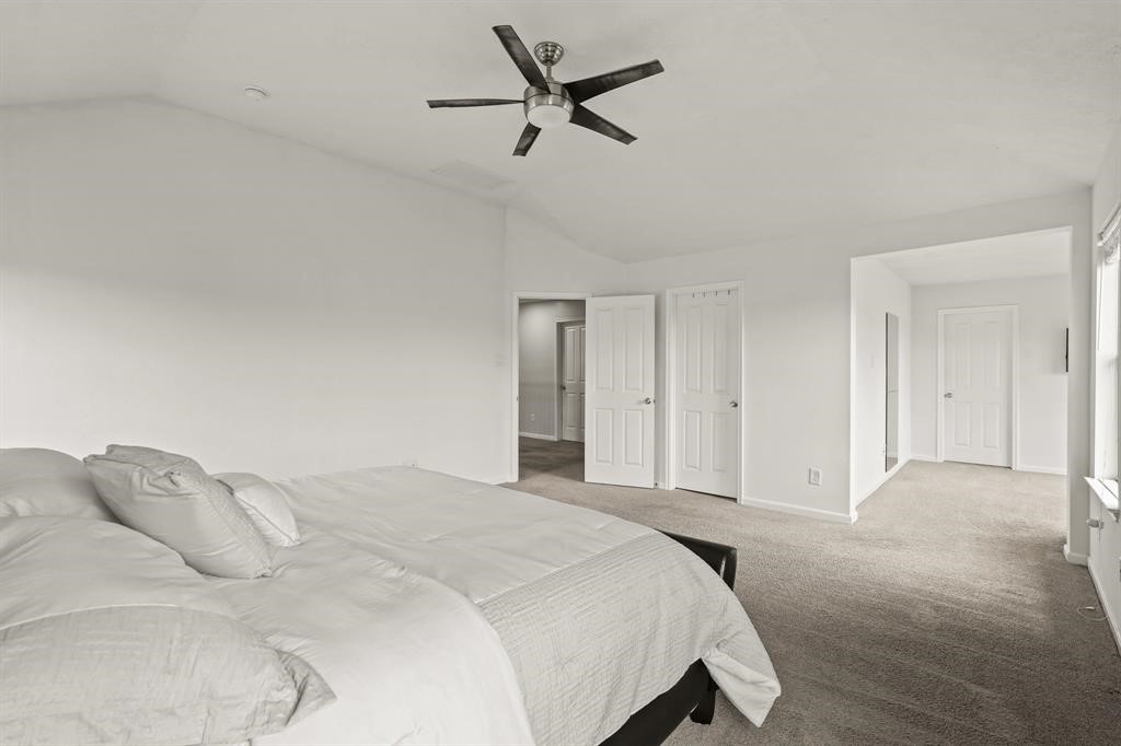 6719 Path Way Court Katy, TX 77449 - Photo 22 of 35 a bedroom with a bed and a large window