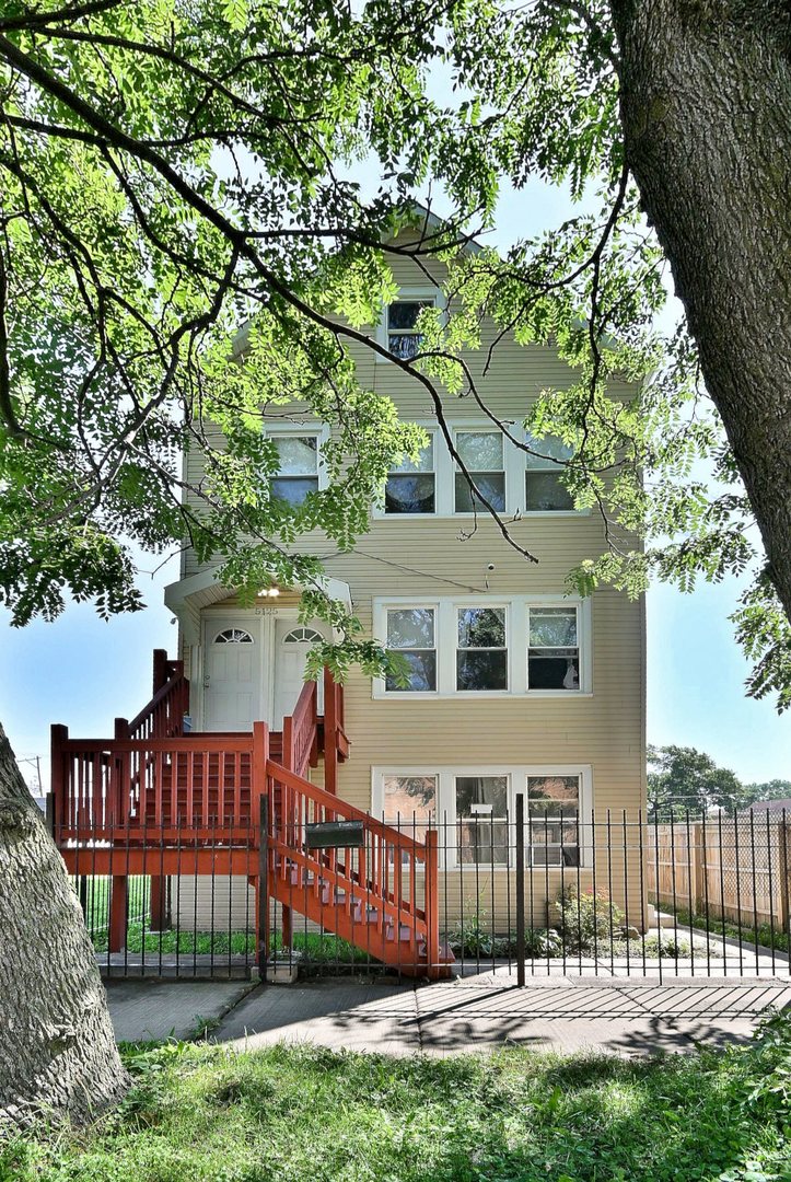5125 South Elizabeth Street Chicago, IL 60609 - Photo 1 of 61 a front view of a house with a garden