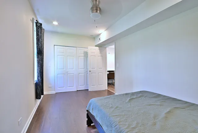 a living room with couches and a coffee table with wooden floor