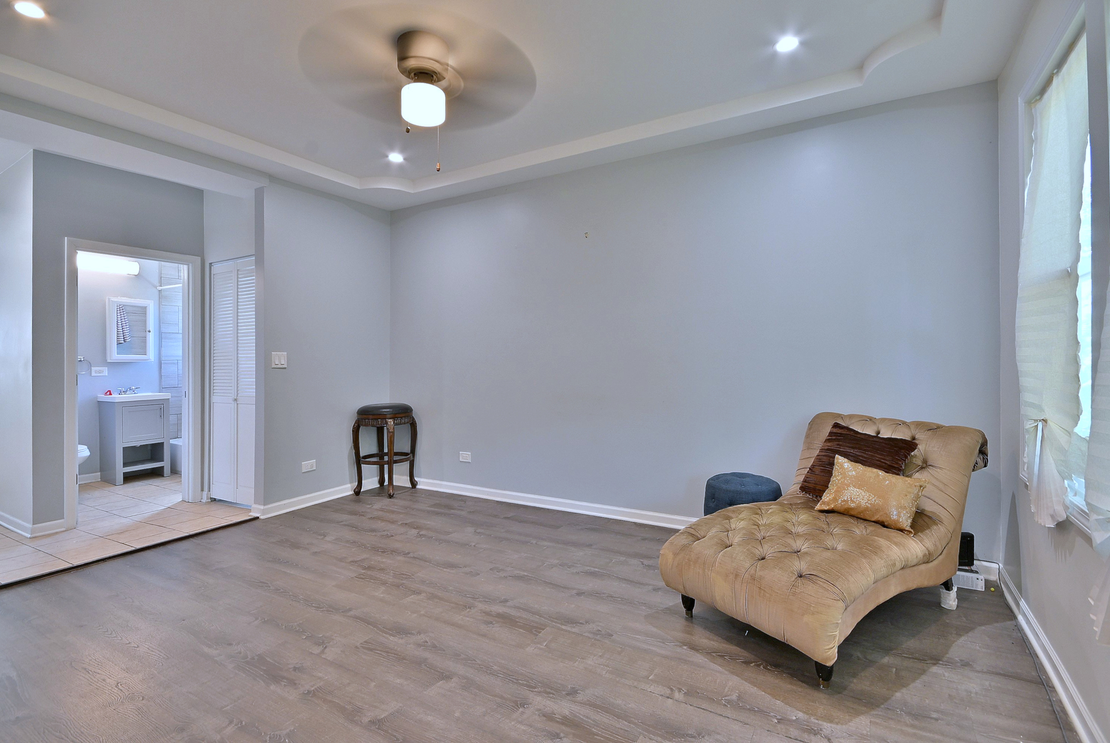 5125 South Elizabeth Street Chicago, IL 60609 - Photo 31 of 61 a bedroom with a bed and a chandelier