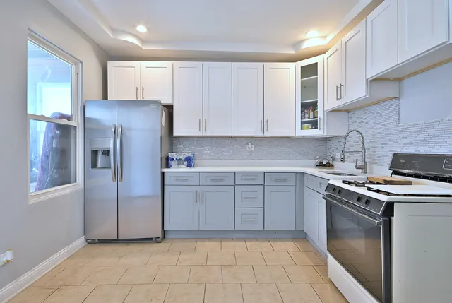 a white toilet sitting next to a bathroom sink