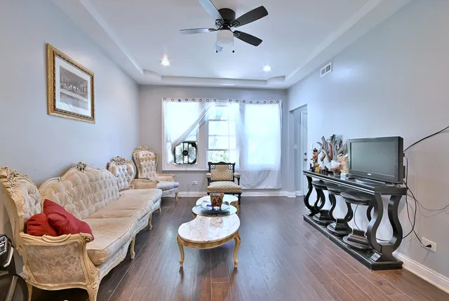 a kitchen with kitchen island granite countertop a sink a stove and cabinets