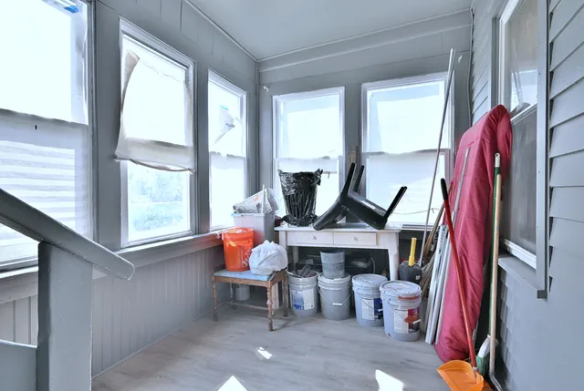 a kitchen with kitchen island a stove a sink and a refrigerator
