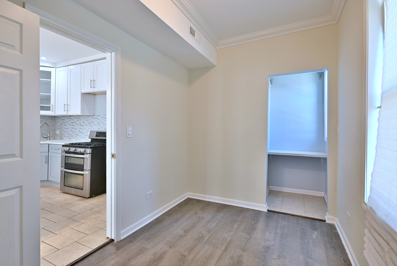 5125 South Elizabeth Street Chicago, IL 60609 - Photo 44 of 61 a view of a kitchen with wooden floor and electronic appliances