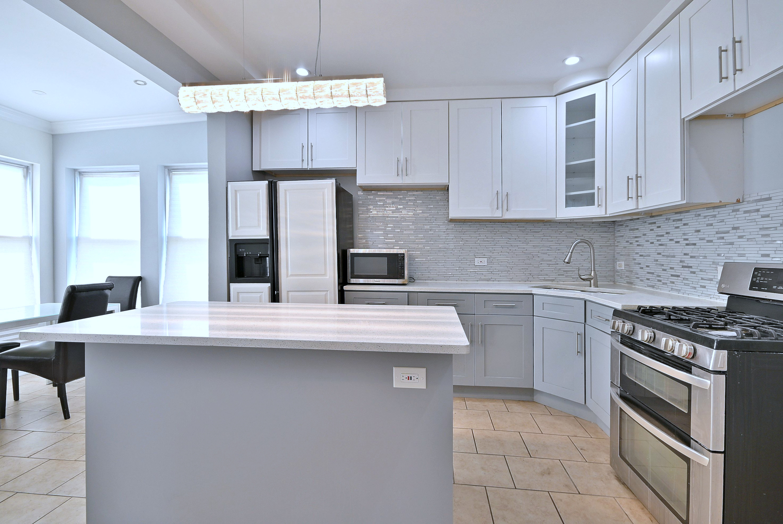 5125 South Elizabeth Street Chicago, IL 60609 - Photo 46 of 61 a kitchen with kitchen island granite countertop a sink a stove and cabinets