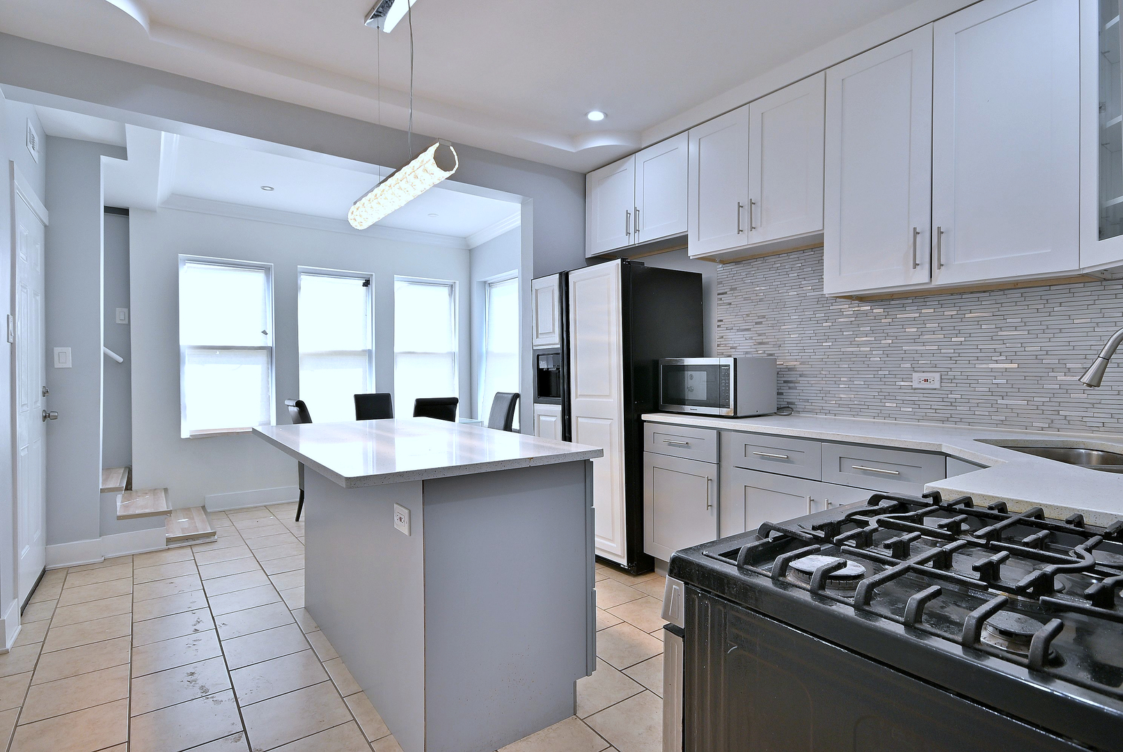 5125 South Elizabeth Street Chicago, IL 60609 - Photo 47 of 61 a kitchen with stainless steel appliances a sink stove and refrigerator