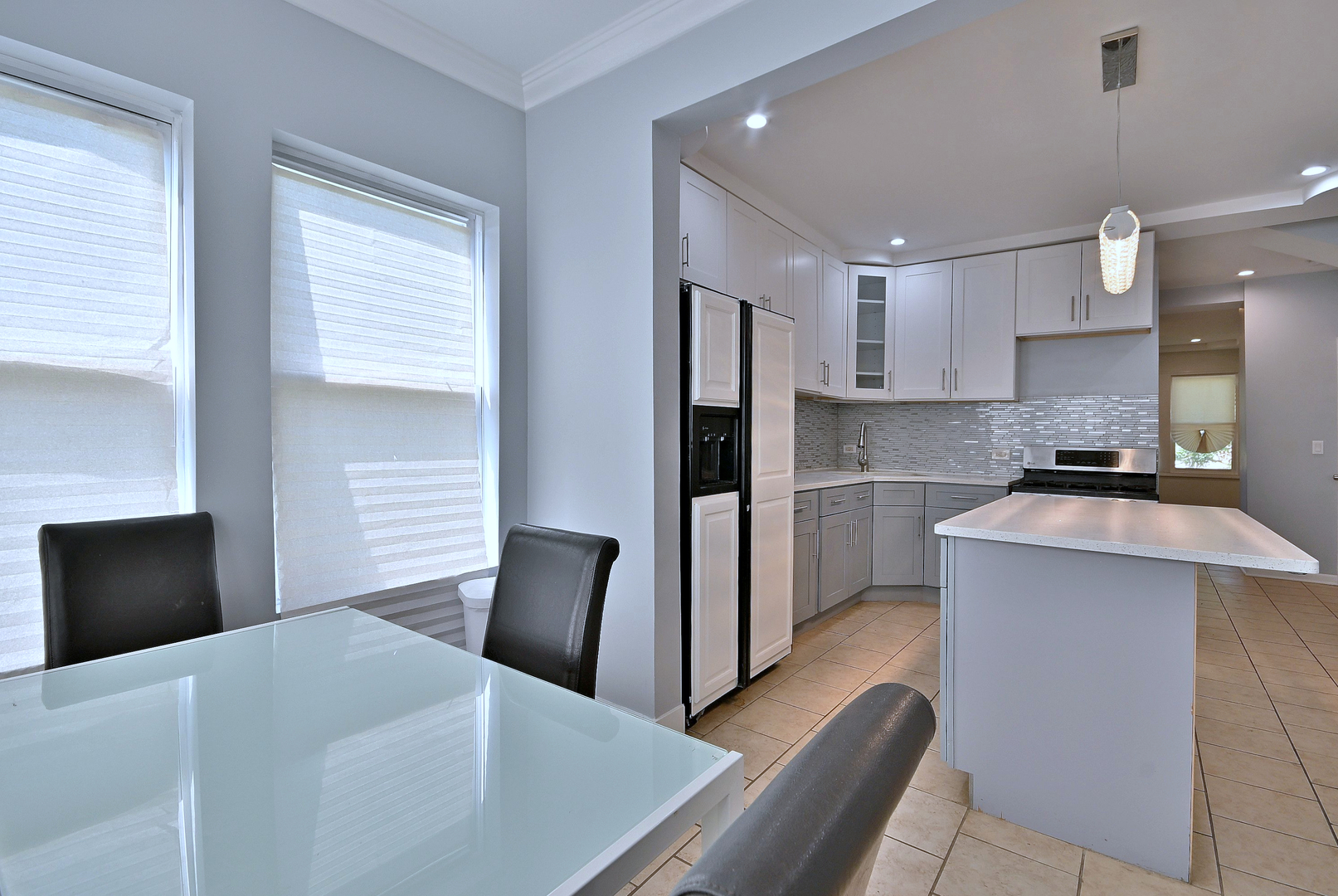 5125 South Elizabeth Street Chicago, IL 60609 - Photo 52 of 61 a kitchen with stainless steel appliances kitchen island a refrigerator sink and cabinets