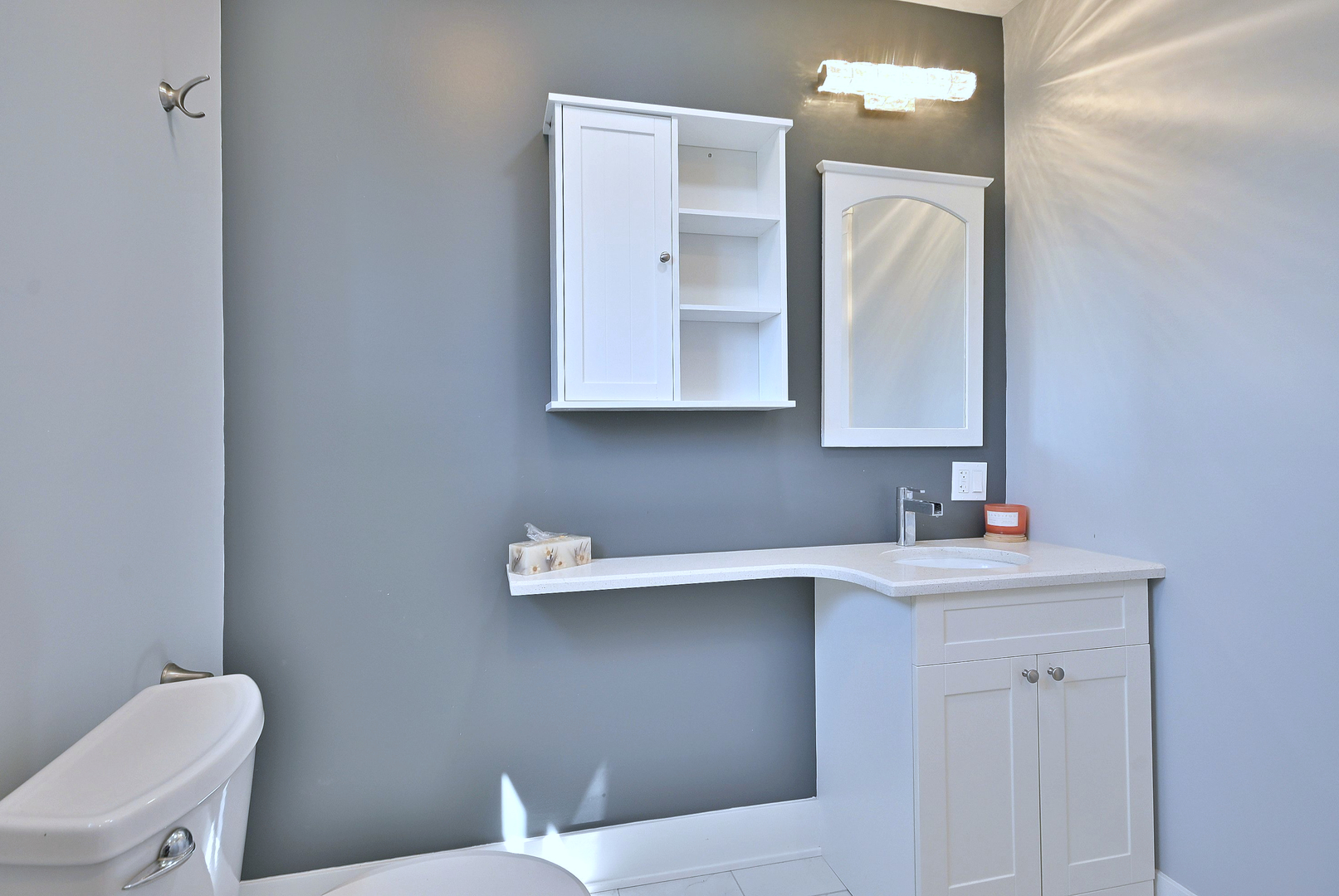 5125 South Elizabeth Street Chicago, IL 60609 - Photo 61 of 61 a bathroom with a toilet sink vanity and mirror