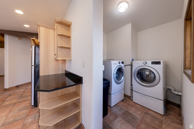 423 Amber Lane Moab, UT 84532 - Photo 25 of 63 Laundry area featuring washing machine and dryer and baseboards