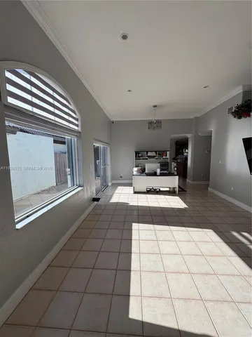 a living room with a large mirror and a rug
