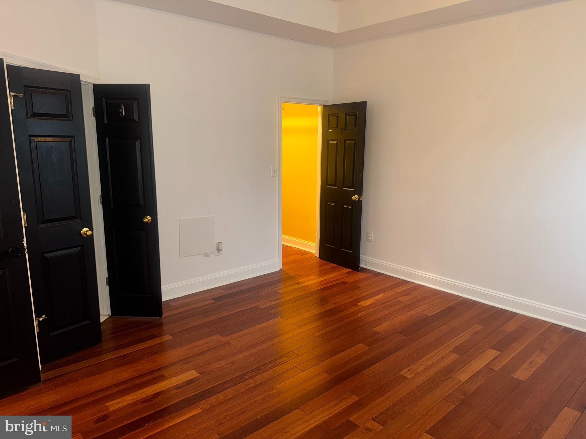 127 Albemarle Street, Unit 36 Baltimore, MD 21202 - Photo 13 of 25 wooden floor in an empty room