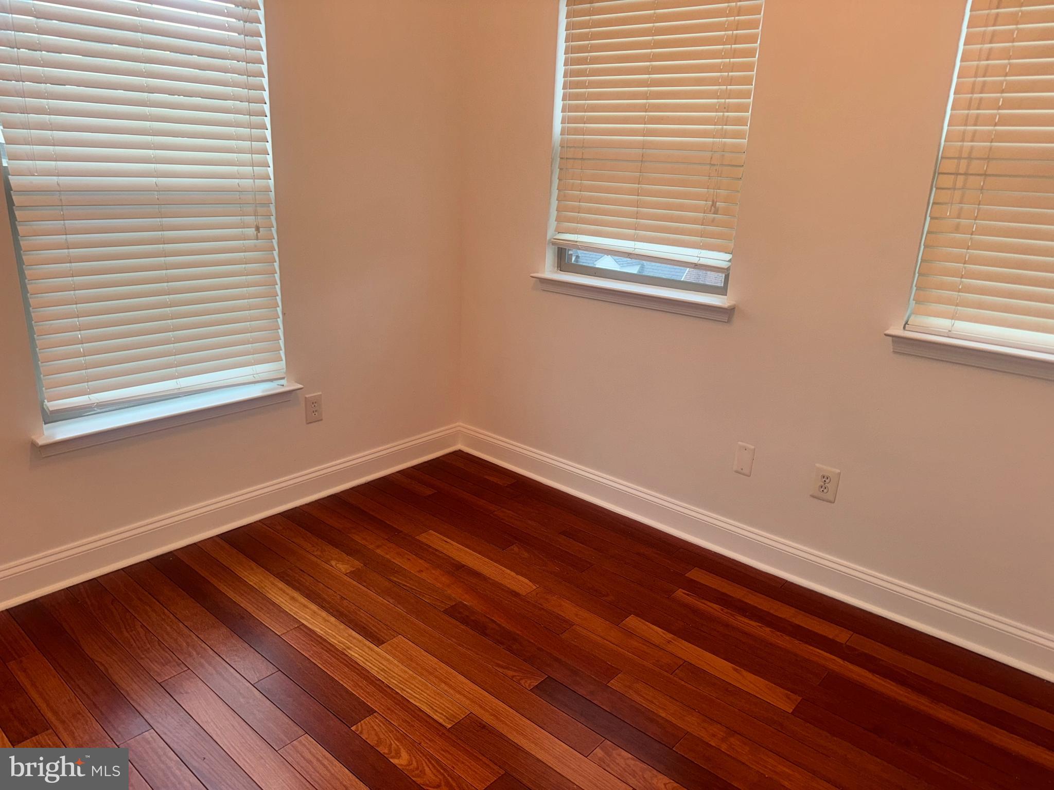 127 Albemarle Street, Unit 36 Baltimore, MD 21202 - Photo 18 of 25 a view of a room with wooden floor and a window