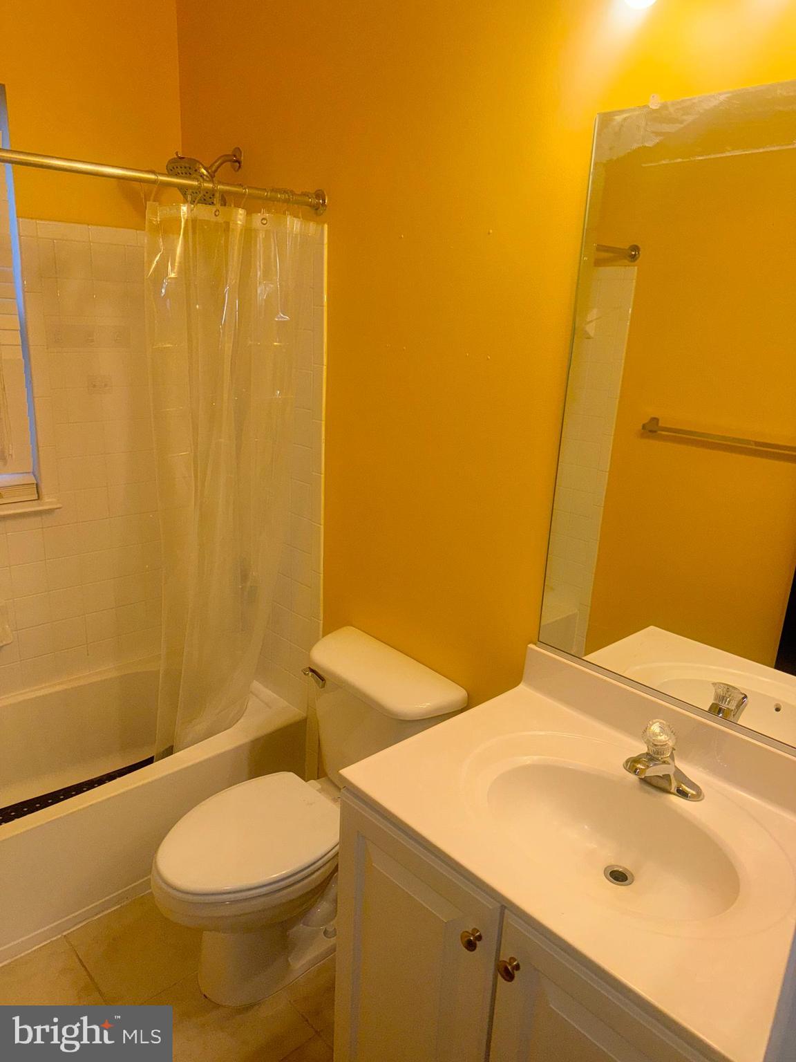 127 Albemarle Street, Unit 36 Baltimore, MD 21202 - Photo 23 of 25 a bathroom with a sink a toilet and shower