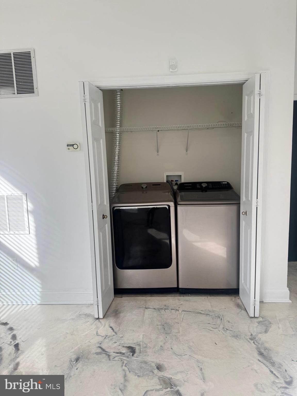 127 Albemarle Street, Unit 36 Baltimore, MD 21202 - Photo 6 of 25 a utility room with washer and dryer