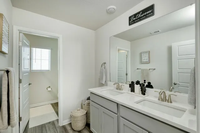 a bedroom with a bed and a chair