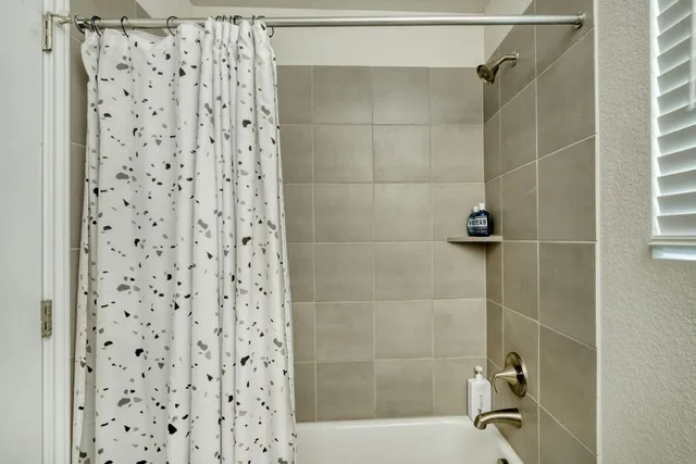 a bathroom with a sink vanity mirror and toilet