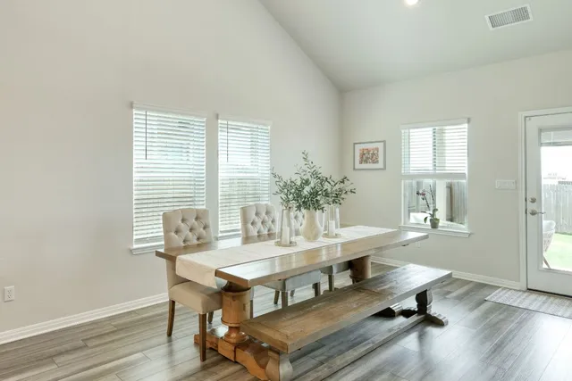 a kitchen with stainless steel appliances kitchen island granite countertop a sink stove and refrigerator