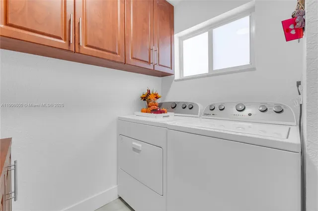 a utility room with closet dryer and washer